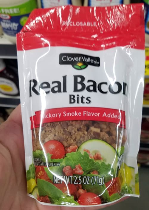 Cook raw bacon if you have time, if not, look for bacon bits like this at your Dollar General Store.
